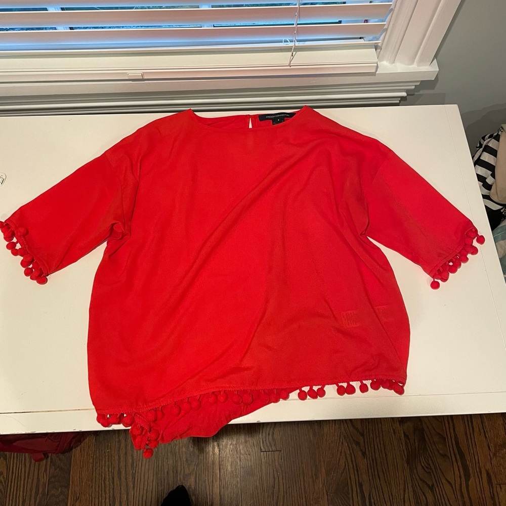 Orange mid sleeve Pom Pom top